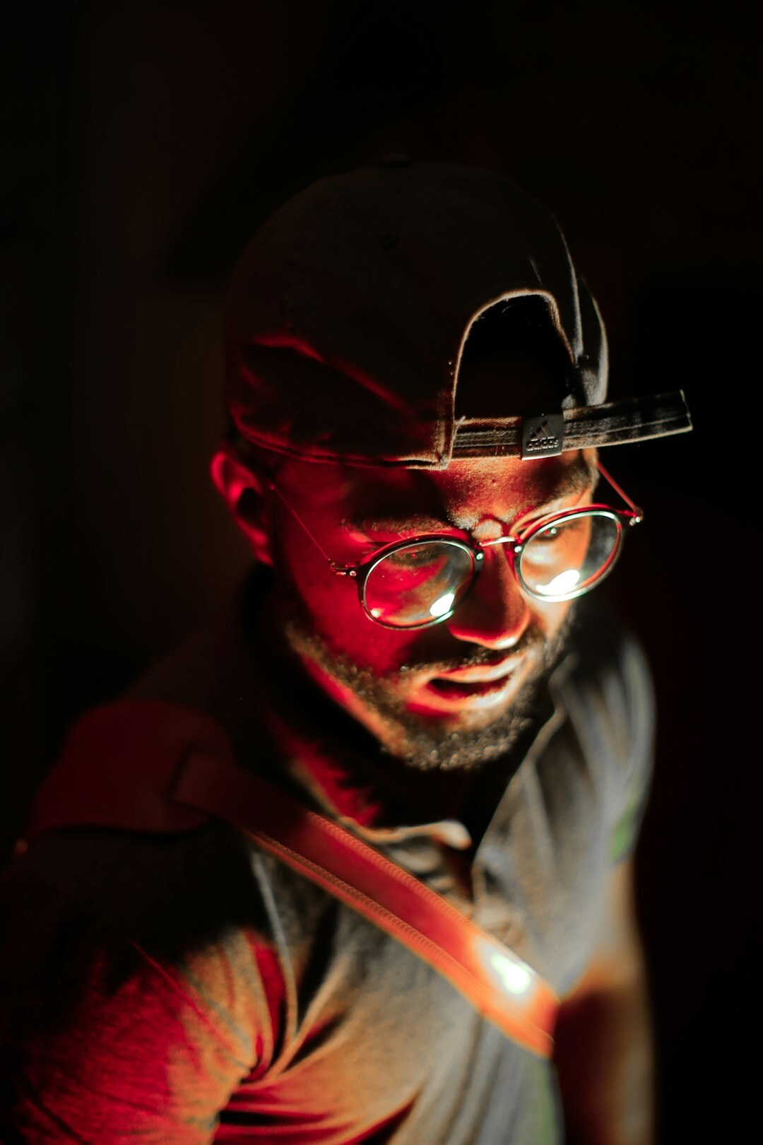 Studio portrait of a male engineer in his 30s wearing glasses
